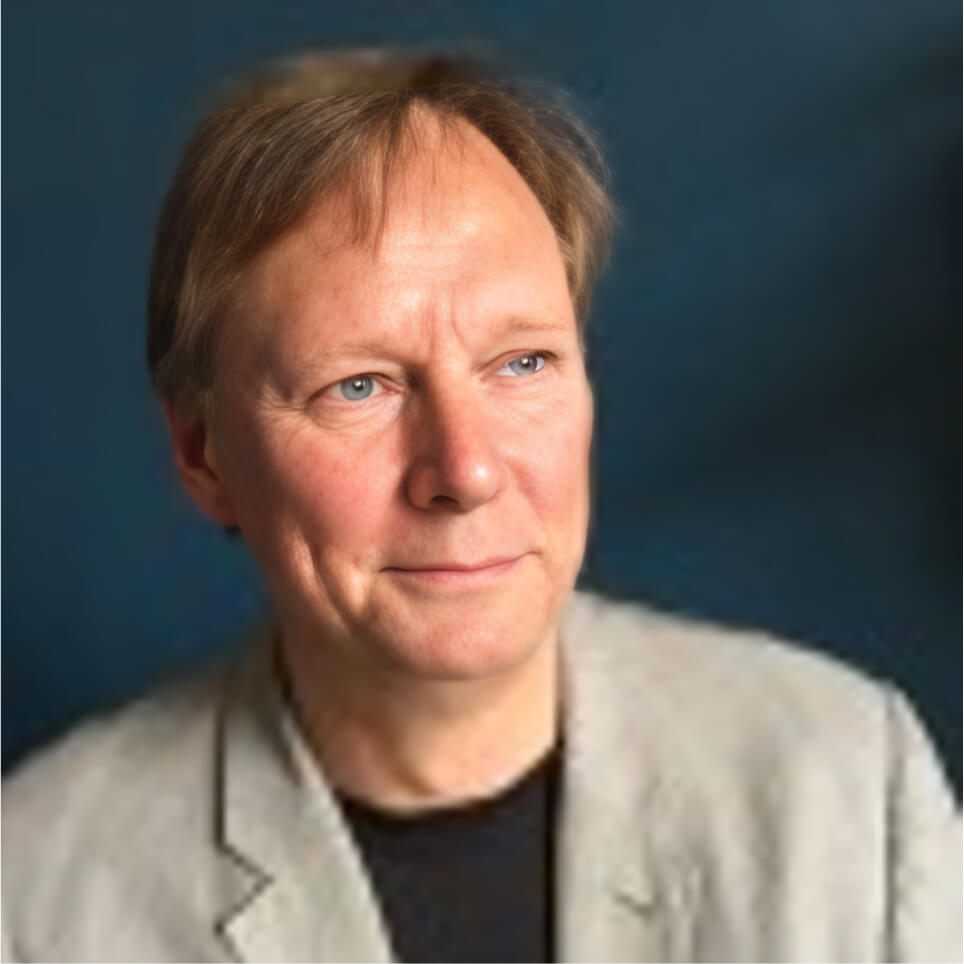 A portrait of Alan Banks, Managing Director at NETbuilder on a dark background